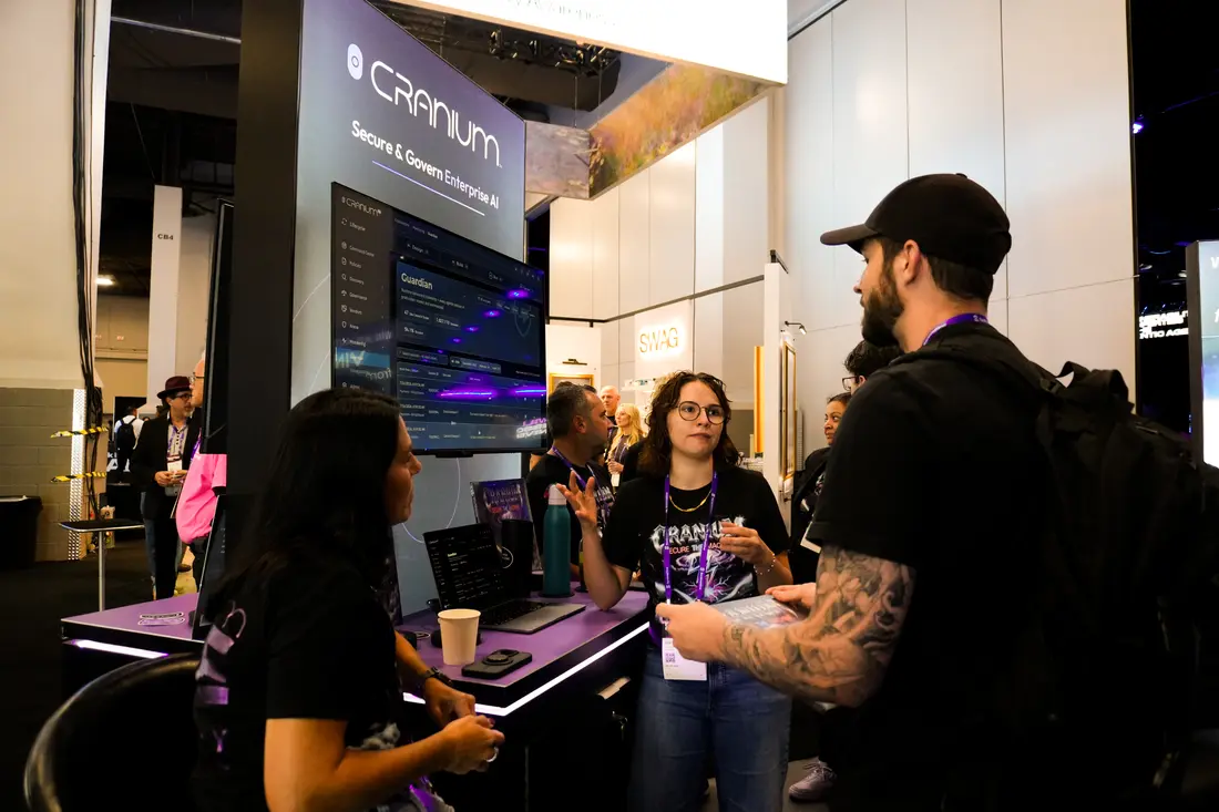 Craniacs walking attendees through the platform at the demo counter