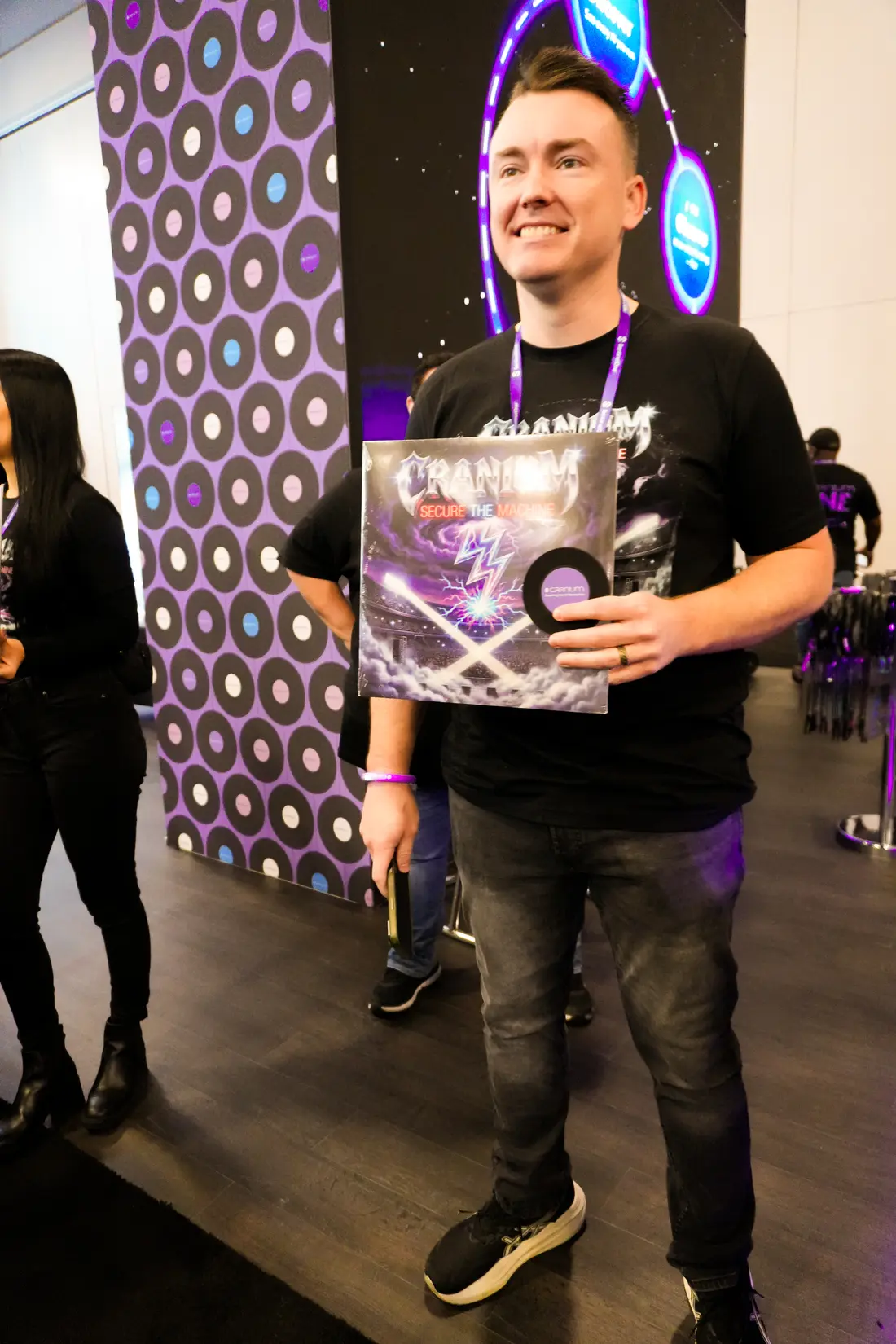 Two attendees leaving with the album under an arm