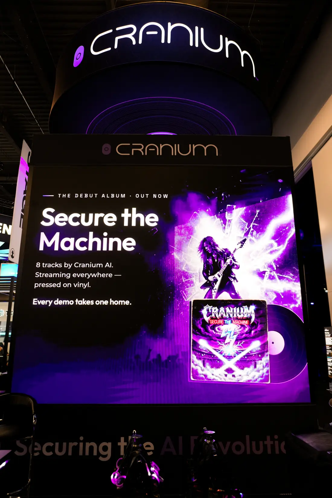 The &ldquo;Secure the Machine&rdquo; debut-album poster at the booth